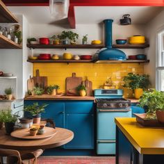 a kitchen with yellow and blue cabinets, wooden counters and shelves filled with potted plants