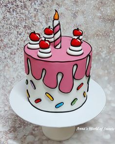 a birthday cake decorated with candles and sprinkles