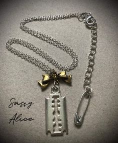 Adorn your neck with this quirky, retro-themed, punk-themed, statement necklace, featuring a 16" fine belcher-style, 925 silver-plated chain, antique bronze effect bow connector, silver effect retro razor blade pendant, and silver-plated effect extender chain, from which a tiny silver effect safety pin charm hangs. Perfect as a self-treat, or as a gift, for any retro-loving punk fan out there. Product Specifications -  Chain - 925 silver-plated, 16", 1.2mm thick Bow connector - antique bronze ef Safety Pin Necklace, Pin Necklace, Razor Blade, Safety Pin, Jewellery Making, Antique Bronze, Favorite Jewelry, Silver Chain, Necklace Etsy