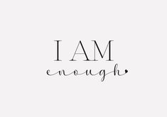 the words i am enough written in black ink