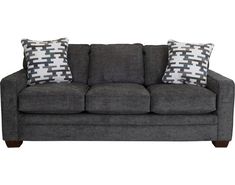 a gray couch with two pillows on it