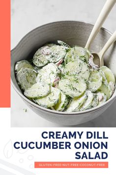 a bowl full of cucumber onion salad with wooden spoons in it and the title creamy dill cucumber onion salad