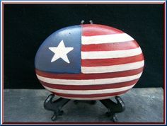 an american flag painted on top of a ball