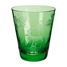 a green glass with an animal design on it