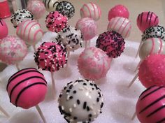 cake pops with sprinkles and black dots on them