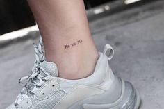 a woman's foot with a small tattoo on her left ankle that reads, i love you so much