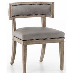 an upholstered chair with studded trimmings on the back and seat