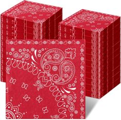 red paper napkins with white paisley designs on them