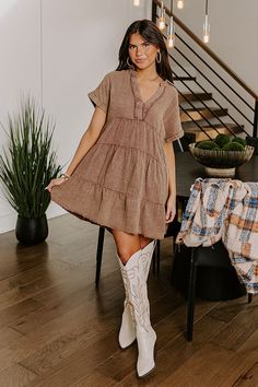 - Go with the flow in this casual dress! - Unlined mineral washed material with a subtle texture - A collared v-cut neckline with stitching for additional coverage and frayed accents - Short sleeves with rolled cuffs - A relaxed silhouette that ends in mini dress length, unfinished, frayed hemline Casual Brown V-neck Mini Dress, Brown Cotton V-neck Mini Dress, Western Boho Chic, Go With The Flow, Western Boho, Country Western, Subtle Textures, V Cut, V Cuts