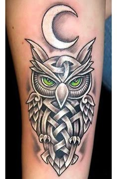 an owl with green eyes and celtic designs on its leg, sitting in front of the moon