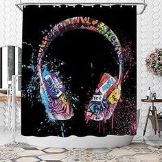 the shower curtain is decorated with headphones and spray paint, which are on display