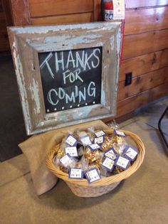 a basket filled with lots of food next to a chalkboard that says thanks for coming