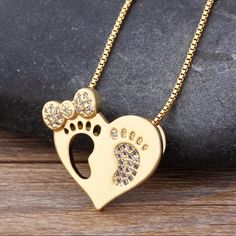 Material 14k Gold Plated & Simulated Diamonds. Heart Bow Baby Feet Necklace Weight 10g Feet Necklace, Baby Necklace, Baby Bows, Gold Heart, Heart Of Gold, Locket, Womens Jewelry Necklace