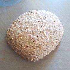 an uncooked doughnut sitting on top of a table