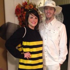 a man and woman dressed in bee costumes