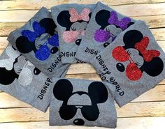 four mickey mouse shirts with glitter ears on them