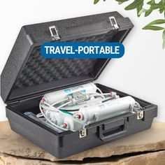 an open suitcase with two medical devices inside it and the words travel - portable written in blue