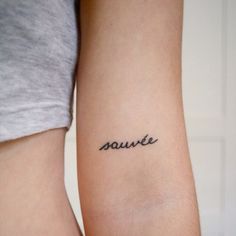 two people with tattoos on their arms and one has the word soule written in cursive font