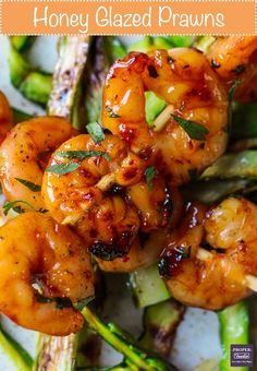 grilled shrimp and asparagus on a white plate