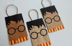 three harry potter paper bags with glasses on them