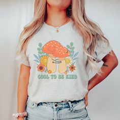 **Dec. 11th is the last day to order for guaranteed delivery by Christmas.  Anything ordered after is at your own risk.** Retro Mushroom Shirt, Aesthetic Mushroom Shirt, Botanical Shirt, Cottagecore Shirt, Nature Lover Mushroom Tee, Fungus Shirt, Be Kind Shirt Bella Canvas are super soft tees! These shirts are made in the USA are high-quality unisex t-shirt that is insanely soft with an awesome fit. These are unisex. May need to size up for a more relaxed look. Please see size and color chart. * Unisex, crewneck, short sleeve, adult t-shirt * Jersey, short sleeve, crew-neck * Soft, high-quality and light fabric  * Monitors can skew the actual color of the shirt.  Print size may slightly vary by print company *We cannot accept returns, refunds or exchanges because each shirt is made to orde Casual Mushroom Print T-shirt For Spring, Summer Cotton Shirt With Mushroom Print, Fall Mushroom Print Graphic T-shirt, Casual Relaxed Fit Shirt With Mushroom Print, Cotton Shirt With Mushroom Print For Summer, Fall Mushroom Print Graphic Tee, Fall Graphic Tee With Mushroom Print, Graphic Tee Shirt With Mushroom Print, Casual Summer T-shirt With Mushroom Design