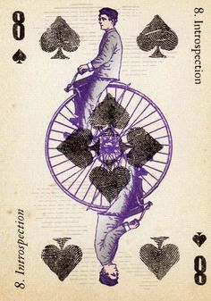 the back side of a playing card with an image of a man holding a wheel