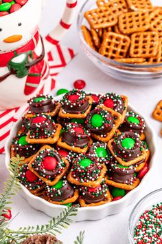 christmas cookies and pretzels in a bowl on a table