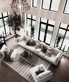 an aerial view of a living room with large windows