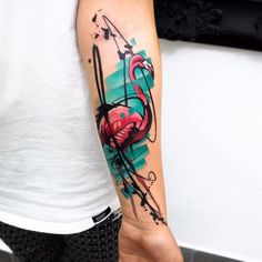 a person with a flamingo tattoo on their arm