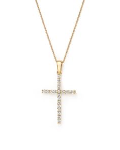 A diamond cross pendant suspends from a sleek 14K yellow gold chain from our exclusive collection. Classic Yellow Gold Cross Diamond Necklace, Classic Yellow Gold Diamond Cross Pendant Necklace, Elegant Yellow Gold Diamond Necklace With Cross Pendant, Elegant Yellow Gold Diamond Cross Pendant Necklace, Elegant Yellow Gold Cross Pendant Diamond Necklace, 14k White Gold Diamond Cross Pendant Necklace, White Gold 14k Diamond Cross Pendant Necklace, Yellow Gold Cross Pendant Necklace With Brilliant Cut, Yellow Gold Brilliant Cut Cross Pendant Diamond Necklace