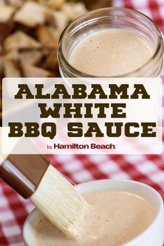 a jar filled with bbq sauce sitting on top of a red and white checkered table