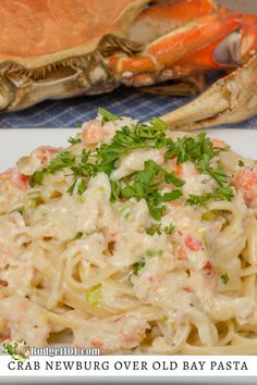 the crab is covered in sauce and garnished with parsley