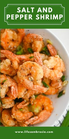 a white bowl filled with shrimp and broccoli on top of a green table