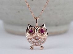 lucky Owl, Diamond Daily pendant Condition: Brand New Style: Diamond Necklace, pendant Side stones : Natural white diamond  (round, 1.2mmx 12 pcs)  natural ruby ( round, 2,2mm x 2) Metal Purity: 10 k ,14 k 18k Solid Rose gold,yellow gold  Comes in a nice jewelry gift box. 100 % handmade in CANADA. Please Contact Us if you have any questions . **Items might appear larger in photos.  Please use a ruler to check dimensions and size before purchase.** White Ruby Necklace For Gift, White Ruby Necklace Perfect For Gifts, Ruby Necklace With Diamond Accents As Gift, Ruby Necklace With Diamond Accents For Gift, Red Jewelry With Single Cut Diamonds, Ruby Jewelry With Single Cut Diamonds As A Gift, Ruby Jewelry With Single Cut Diamonds For Gift, Rose Gold Ruby Jewelry With Diamond Accents, Red Jewelry With Diamond Accents As Gift