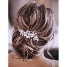 a woman wearing a hair comb with flowers on it