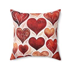 a red and white pillow with hearts on it