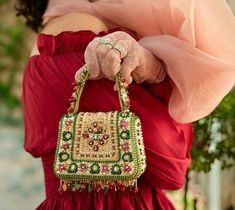 Handmade Clutch Purse for Wedding - Bridal Clutch Bag with Tassel Elevate your bridal look with our Handmade Clutch Purse, a luxurious accessory designed for weddings and special occasions. This bejeweled flapover clutch is adorned with precious gems, micro beads, jadau, and polki jewelry, making it a perfect gift for her.  𝐅𝐞𝐚𝐭𝐮𝐫��𝐞𝐬  Luxurious Bejeweled Design: Embellished with precious gems, micro beads, jadau, and polki jewelry for a truly opulent look. Elegant Tassel Detail: Features Indian Clutch, Handmade Clutch Purse, Wedding Clutch Bag, Purse For Wedding, Modern Clutch, Bridal Clutch Purse, Bridal Clutch Bag, Bag With Tassel, Micro Beads