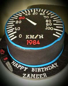 a birthday cake with a speedometer on it