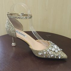 2.5 Inch Glitter Heels With Rhinestone Embellishments. Glamorous Rhinestone Wedding Shoes With Ankle Strap, Glamorous Wedding Shoes With Rhinestones And Ankle Strap, Wedding Shoes With Rhinestones And Ankle Strap, Gold Embellished Heels For Events, Bling Heels With Pointed Toe For Wedding, Wedding Heels With Bling And Pointed Toe, Bedazzled Gold Heels For Wedding, Gold Sparkling Low Heel Shoes, Gold Bedazzled Heels For Wedding