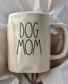 a coffee mug with the word dog mom written on it