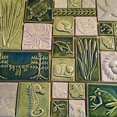 ceramic tiles with animals and plants on them