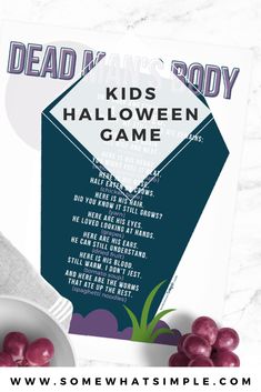 a poster with the words dead man's body kids halloween game in front of grapes