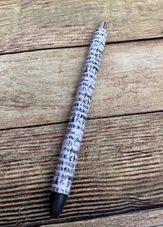 a pen sitting on top of a wooden table