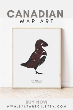 the canadian map art is displayed on a wall next to a wooden frame with an image of a bird