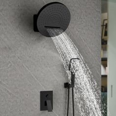 a shower head with water coming out of it