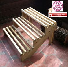 a wooden bench sitting on top of a stone floor