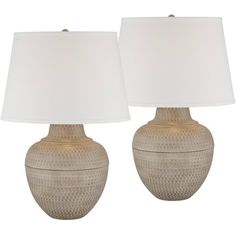 two lamps are sitting next to each other on a white background with one lamp turned off