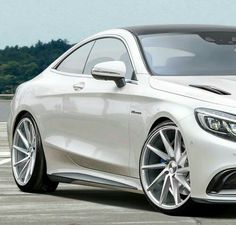 the front end of a white mercedes s - class coupe