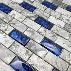 blue and white glass mosaic tiles on the floor