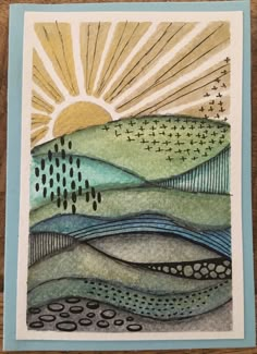 a card with watercolor and ink on it, depicting the sun rising over mountains